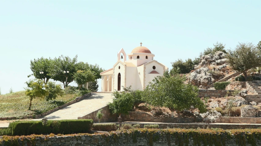 a church that looks like it is built on the hillside