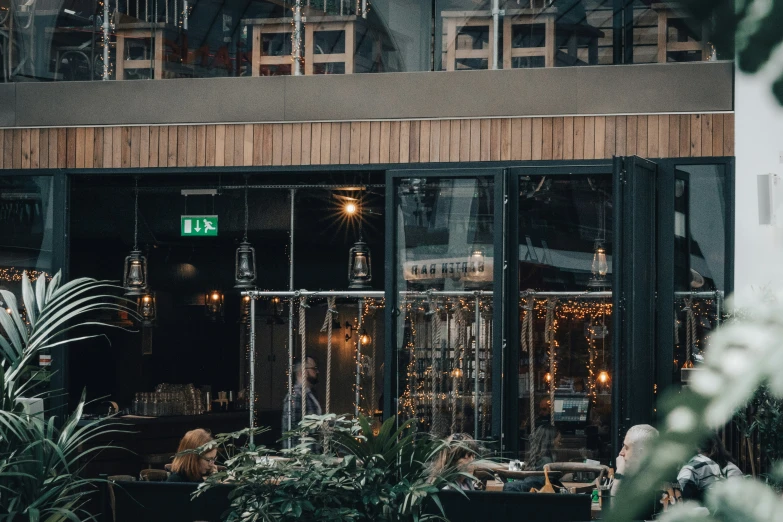 people sitting in the cafe and eating at tables