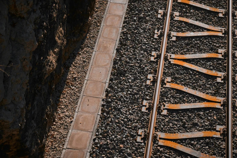 the view down from a train track looking down at a walkway