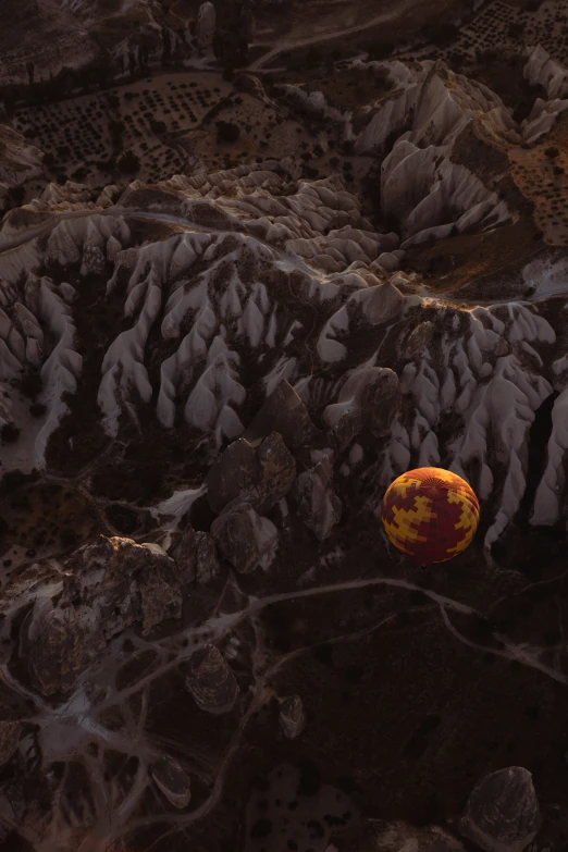 an aerial view shows a large ball with orange paint