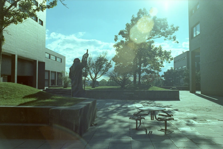 some benches sit on the outside plaza with a view of buildings