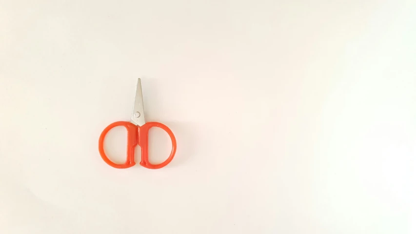 a pair of scissors is shown on the wall