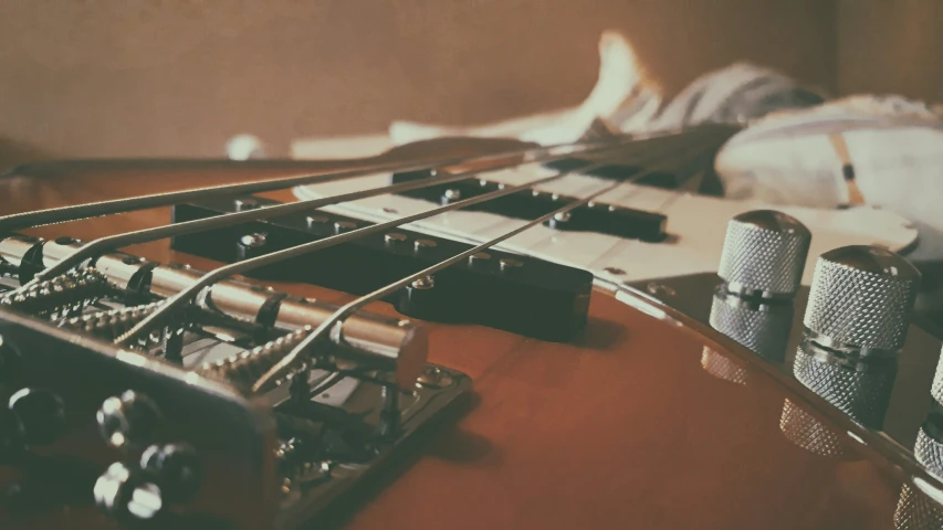 some musical instruments are laying on a bed