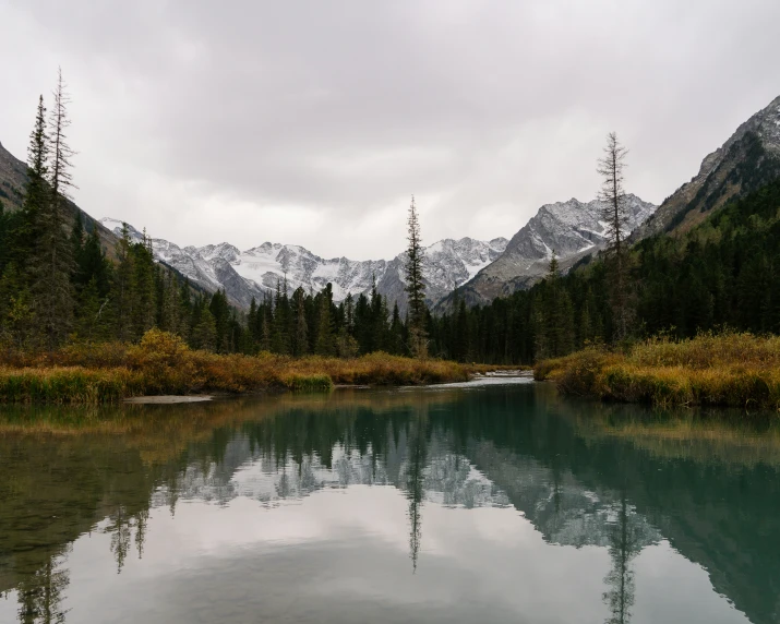 a view of a mountain range and a river in the middle of it