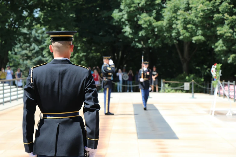 some soldiers and their uniforms standing around