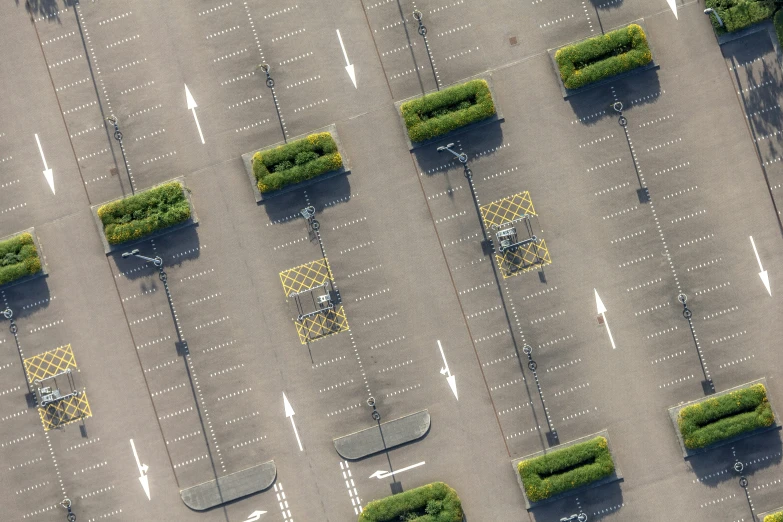 several square trucks and ramps in a parking lot