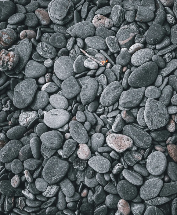 rock background with grey rocks and red pebbles