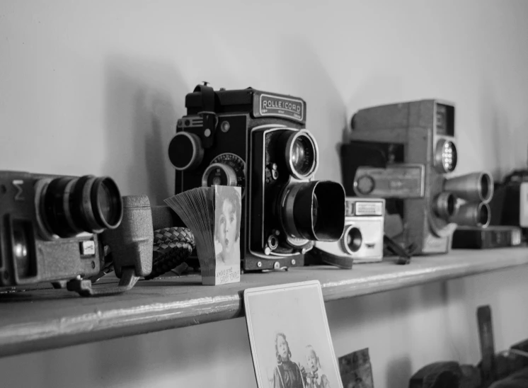 some very old looking cameras in a room