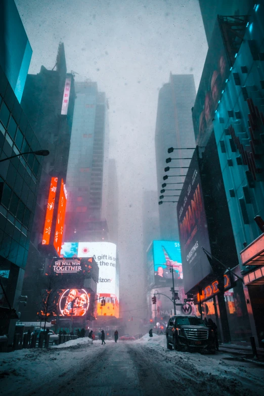 a snowy street with neon buildings in the distance