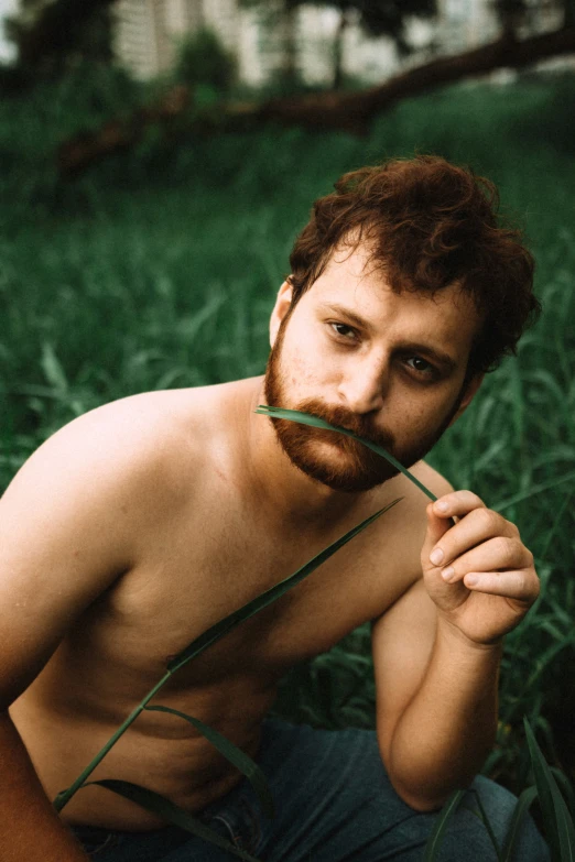 a man with an orange beard wearing shorts