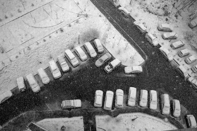 a parking lot with an aerial view of cars