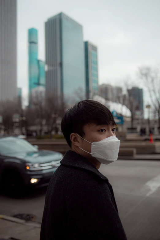 a man wearing a mask on a street