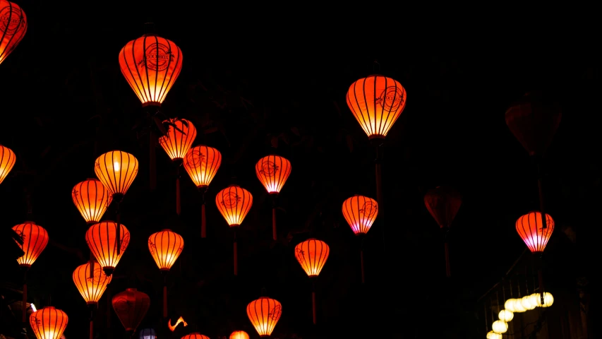 bright lights up into the night sky on a dark background