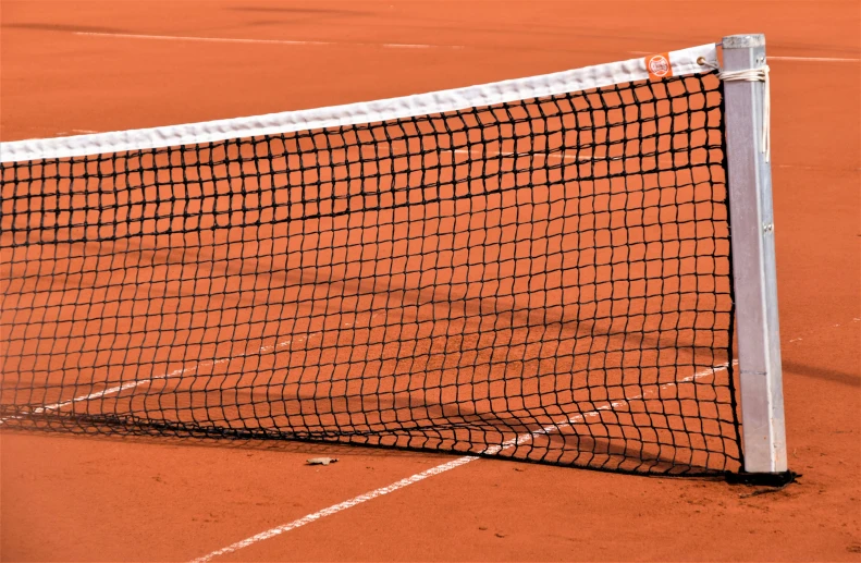 an orange tennis court is seen in this picture