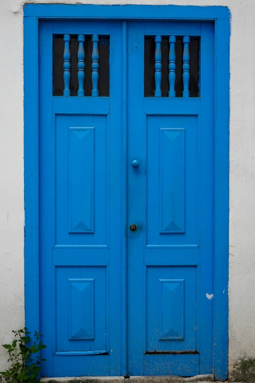 blue door with the window frame painted white