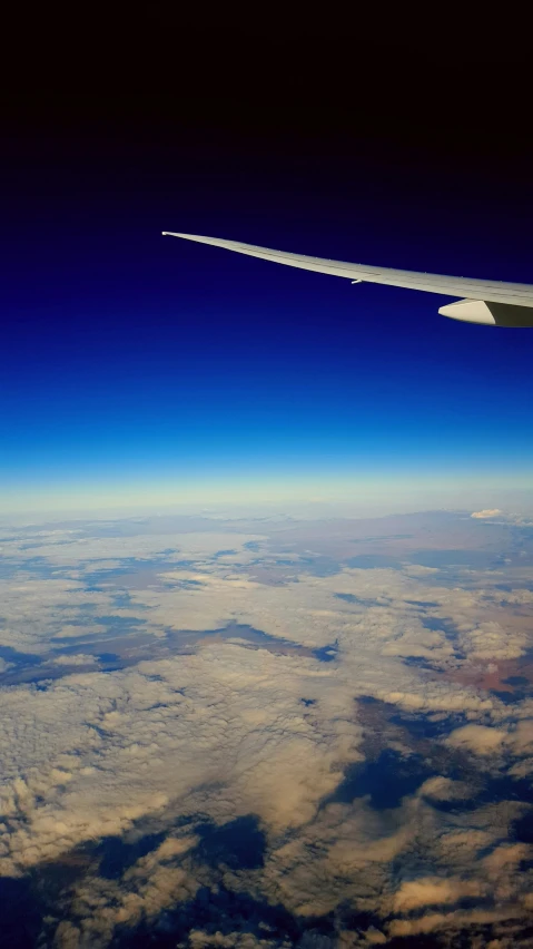 a view of the sky and earth from an airplane