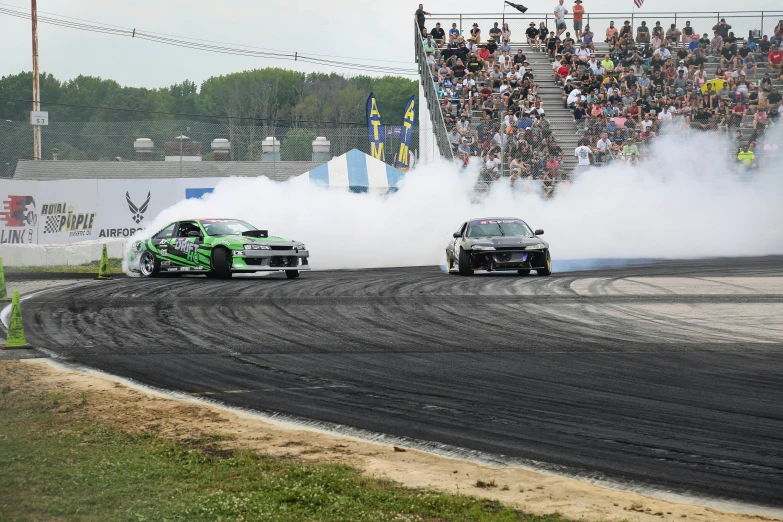 two cars that are sitting on the track