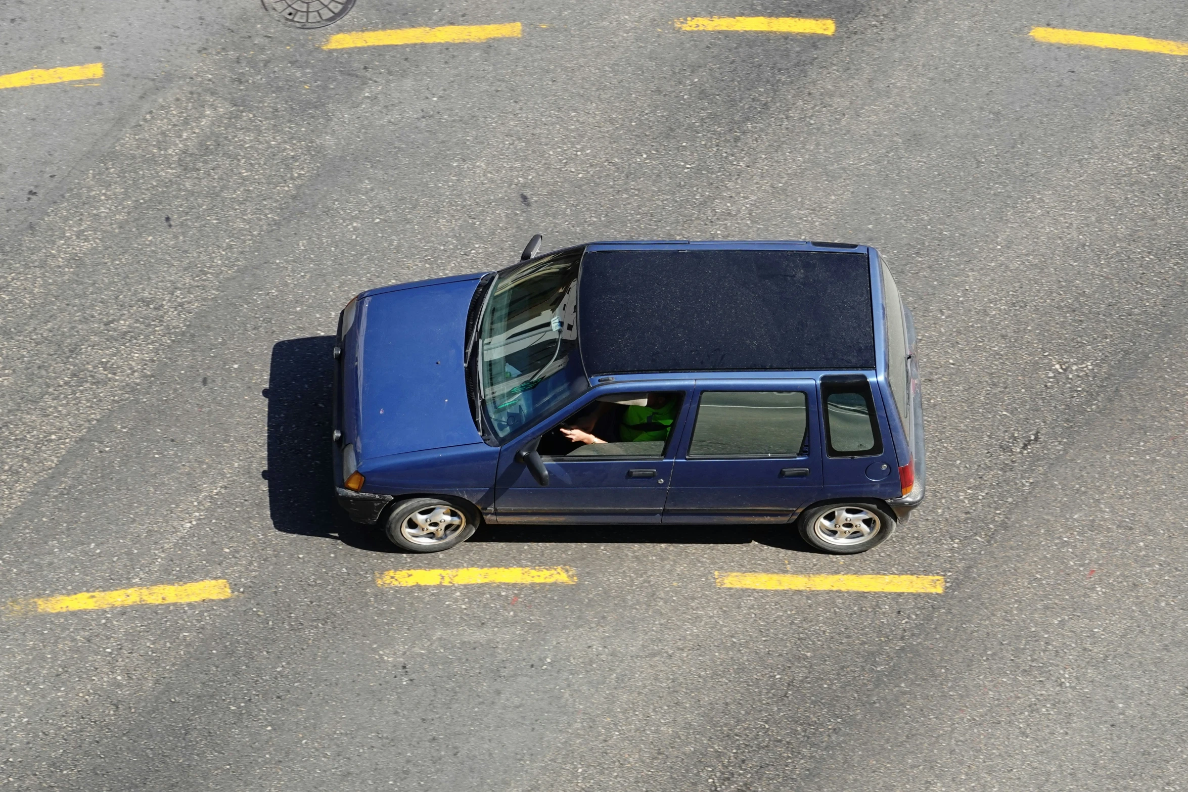 the suv is traveling on an empty street