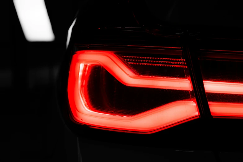 an open car rear light that is bright red