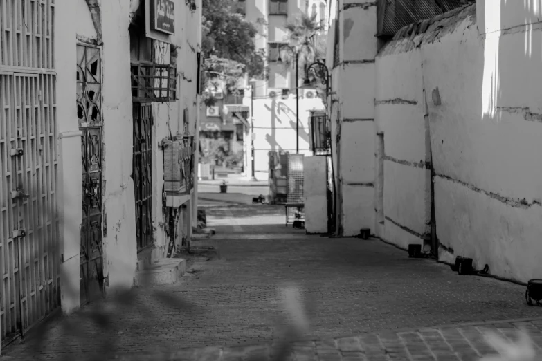 a narrow alleyway with a bunch of windows