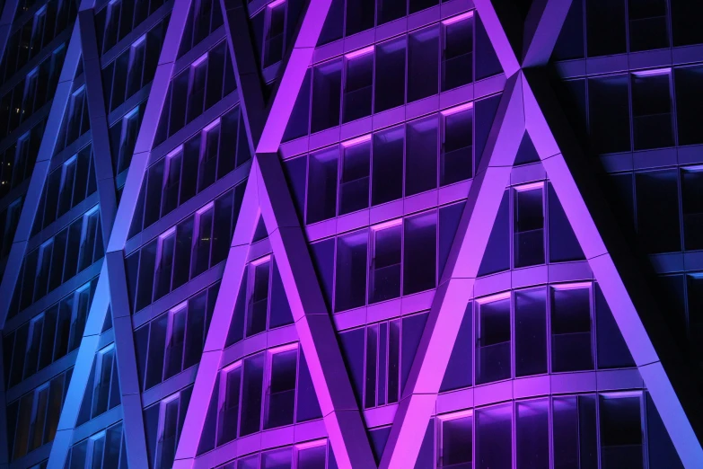 a colorful building lit up in purple