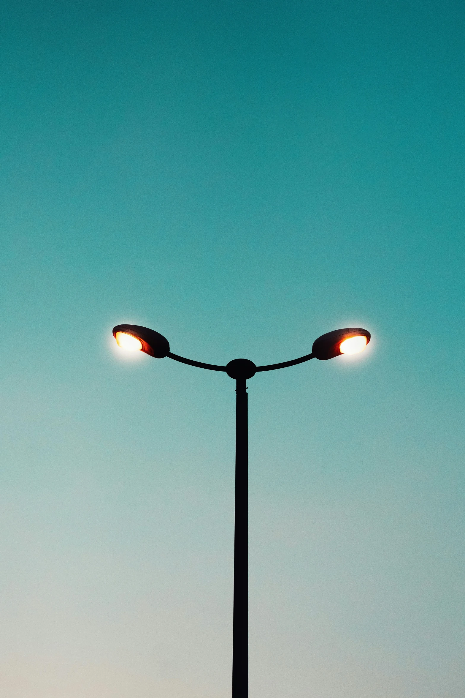 a street light that is lit up on a pole