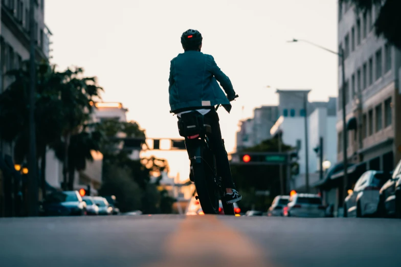 a man riding on a skateboard through the city streets