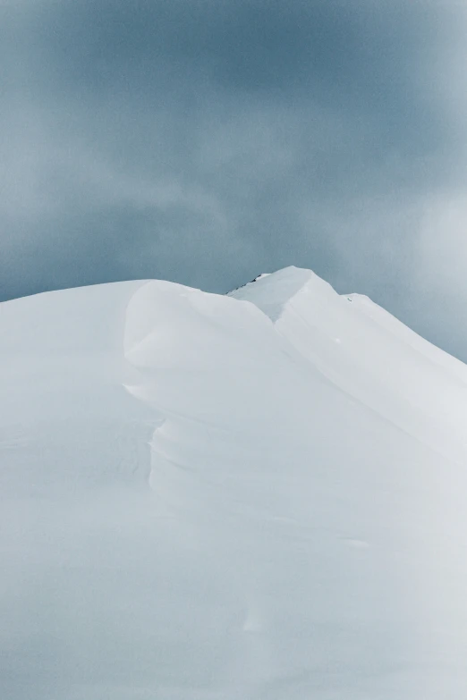 the person skiing down the snow covered hill