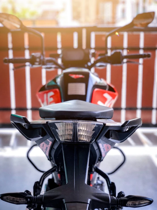 a row of motorcycles parked in front of a building