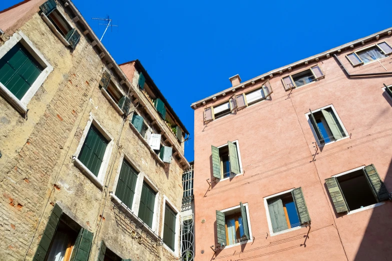 a row of tall brick buildings sitting next to each other