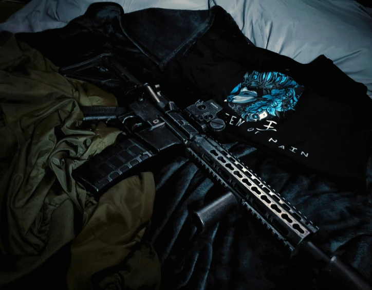 a weapon laying on top of a bed