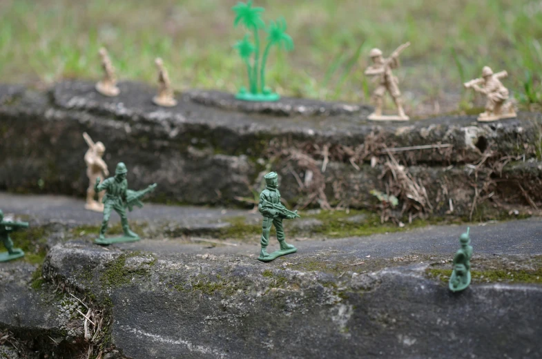 toy army men with weapons and camouflage