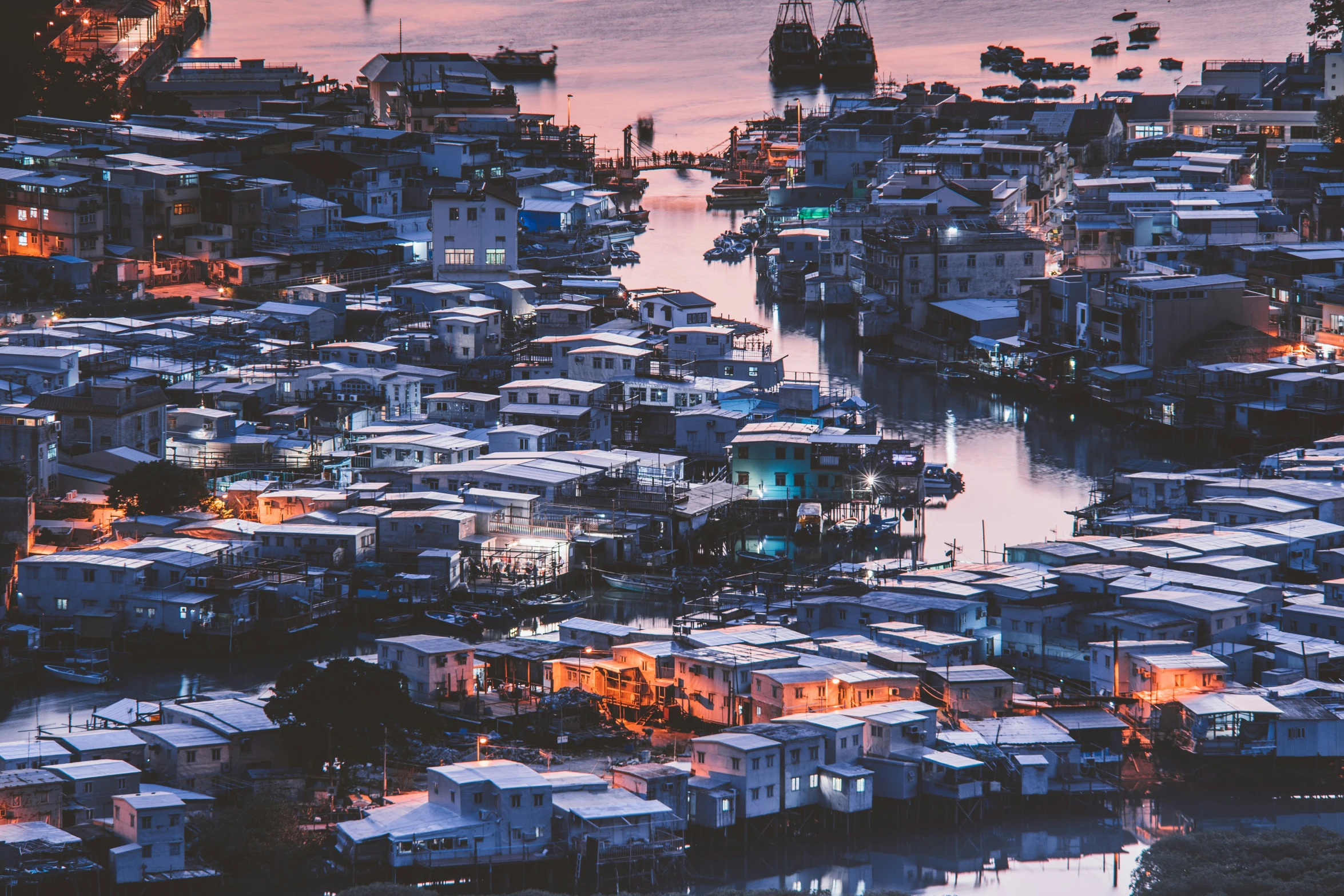 this is a aerial view of a harbor with many houses