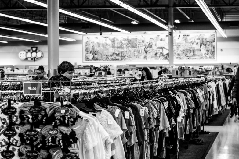 black and white po of store racks of clothes