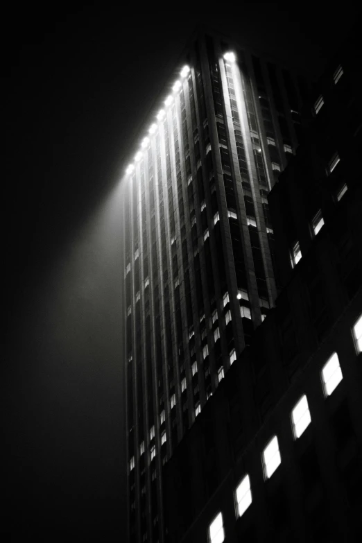 a black and white po of the top of a building with lots of windows