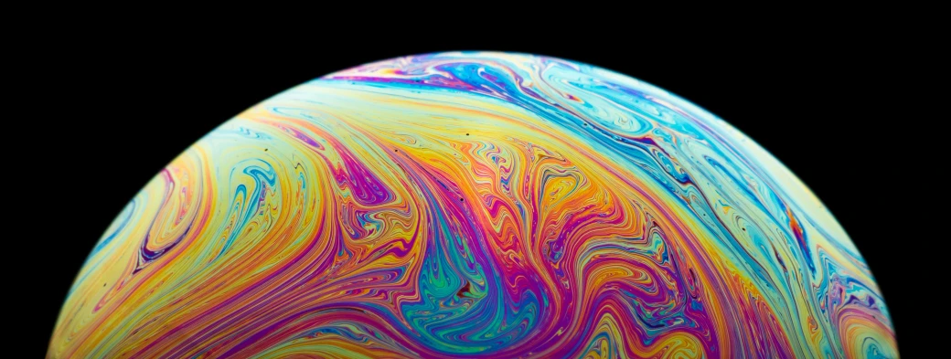 an image of a colorful liquid filled egg