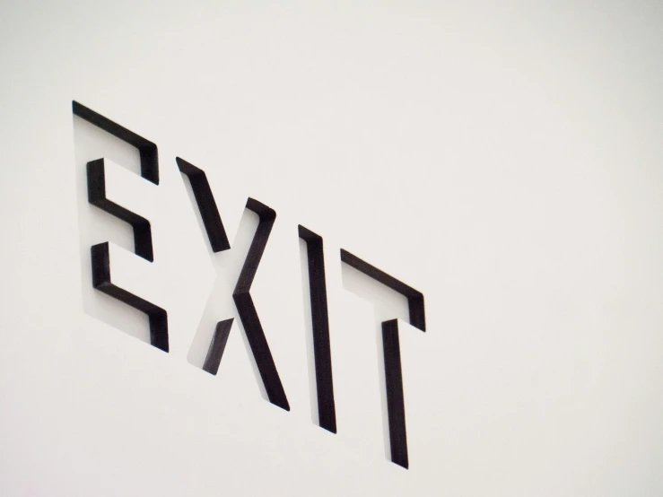 a sign with the word exit next to it