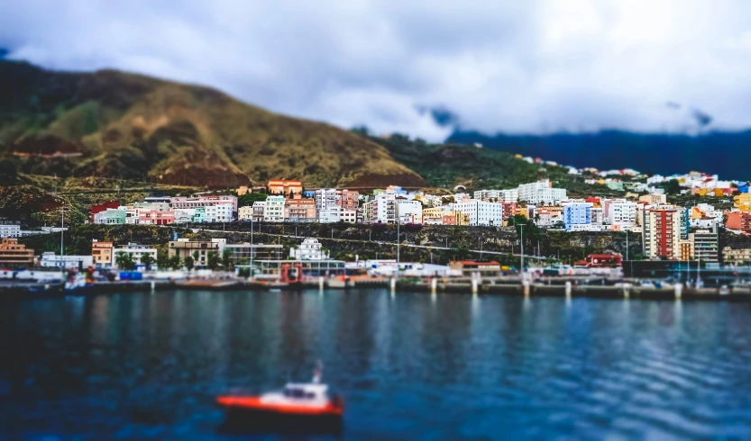 an aerial view of a town by the water