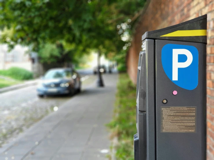 a parking meter on the side of a street