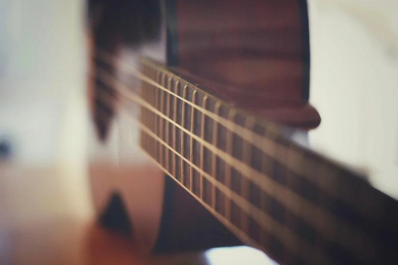 a blurry image of an acoustic guitar fret