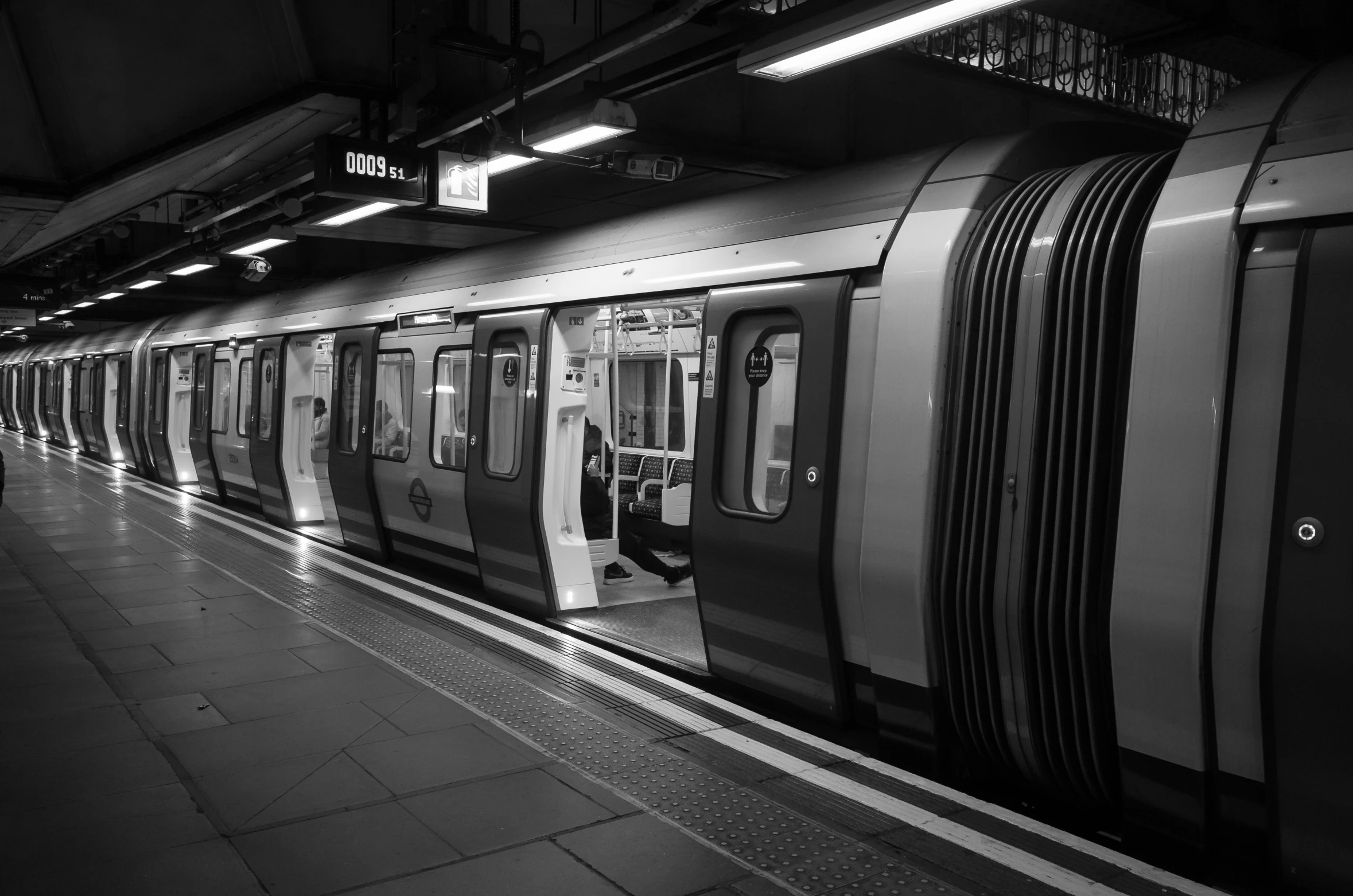 black and white pograph of commuter trains parked