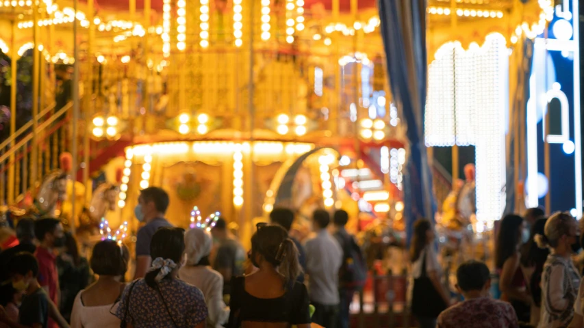 a very large crowd of people and rides