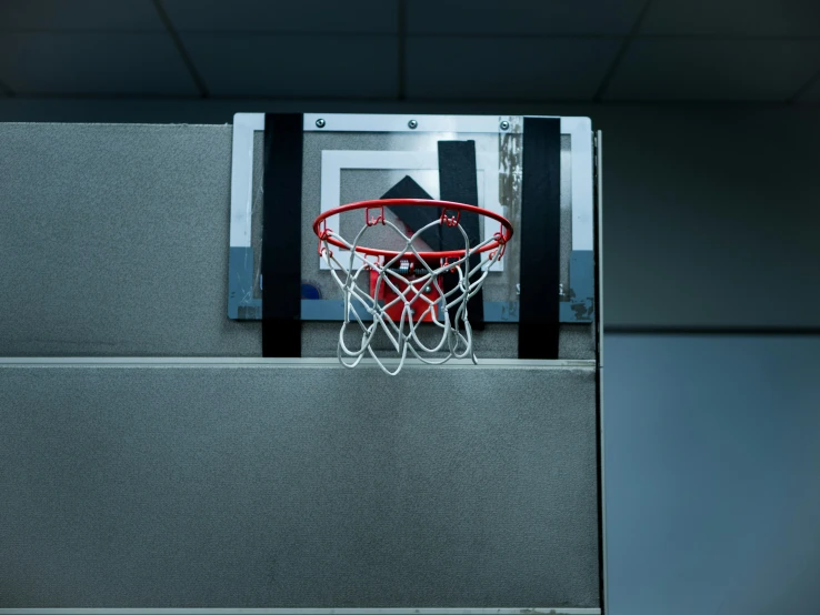 the backboard of a basketball hoop is pulled through an area