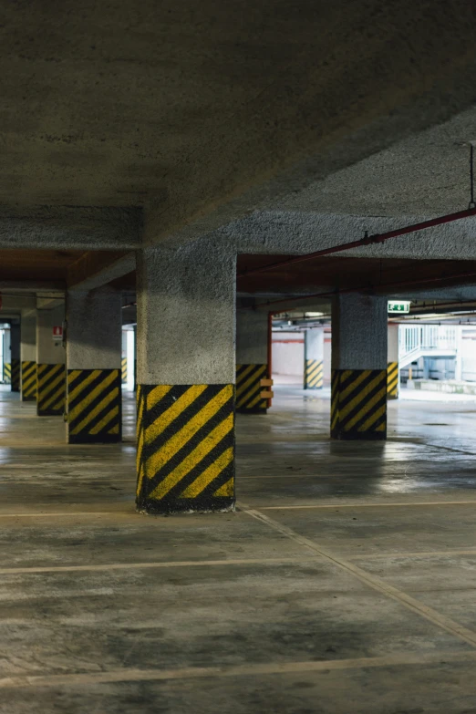 a parking garage with lines indicating a crossing