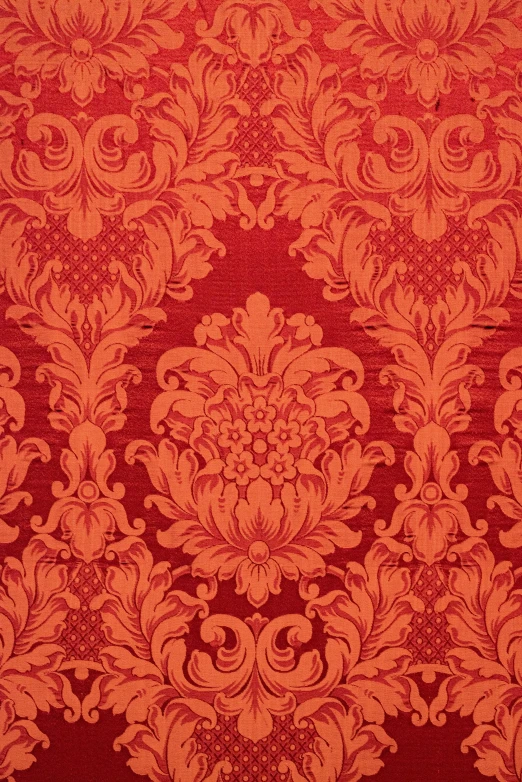 a red floral pattern on fabric for a wall covering