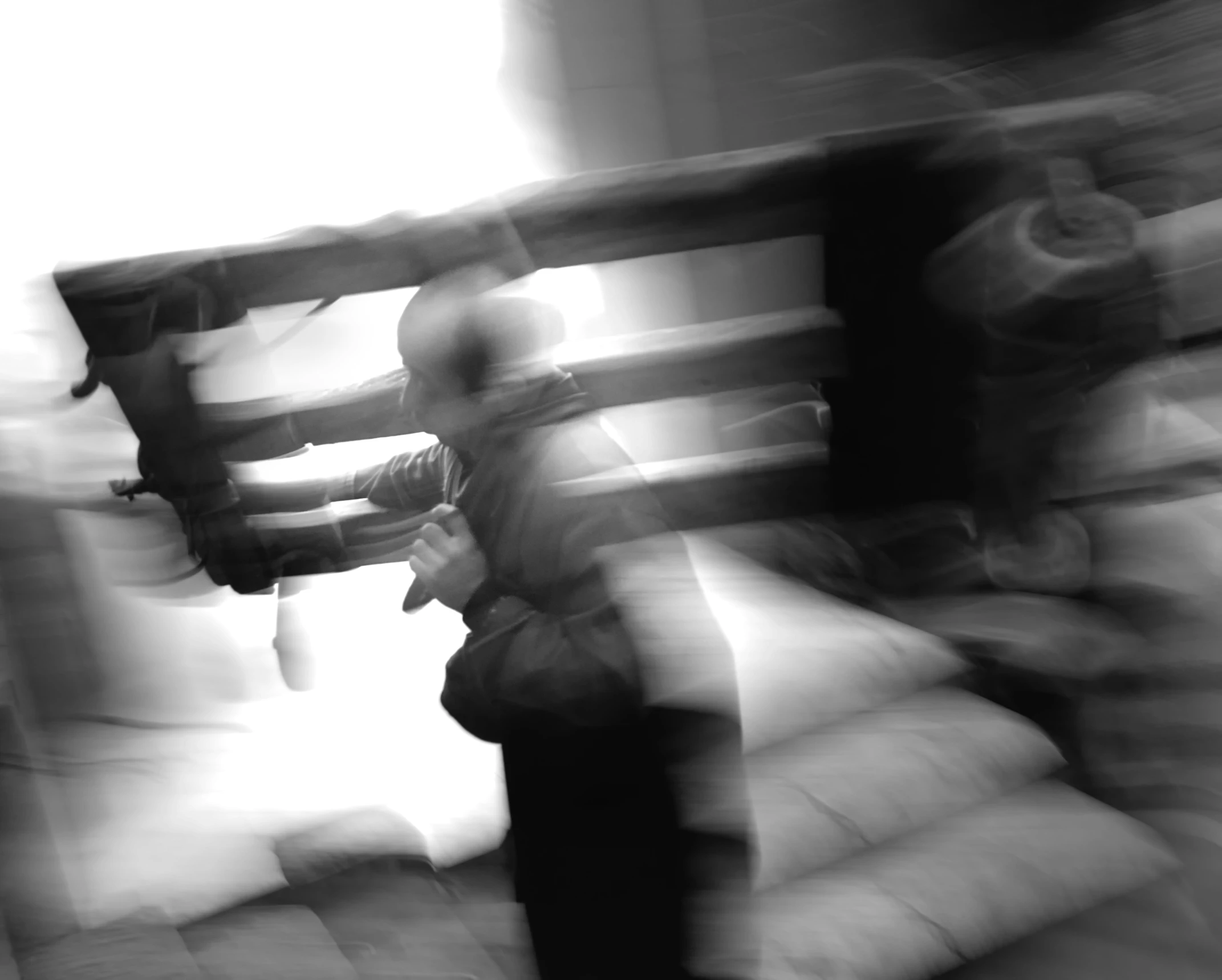 a blurry image of a woman sitting on a couch