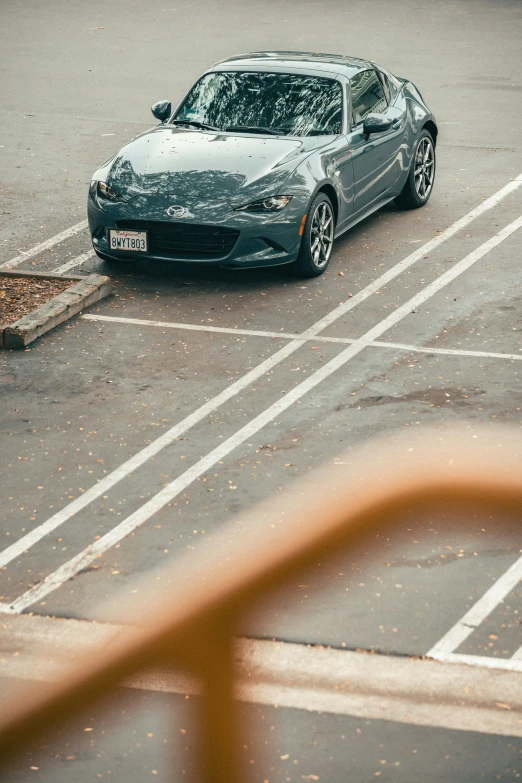 a silver car parked in a parking lot