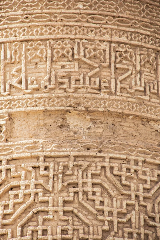 ancient carvings and lines in the outside of a pillar