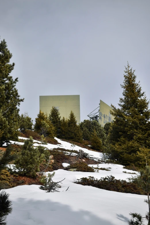 a view of a building in the distance with snow on the ground