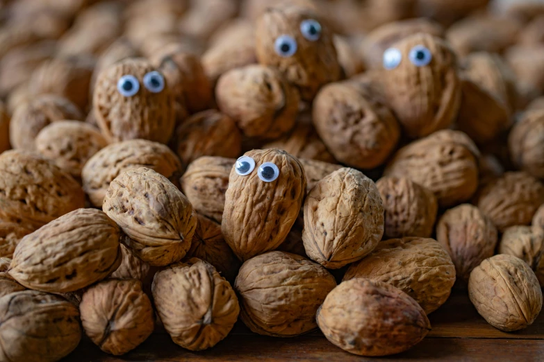 a group of nuts with eyes painted on them